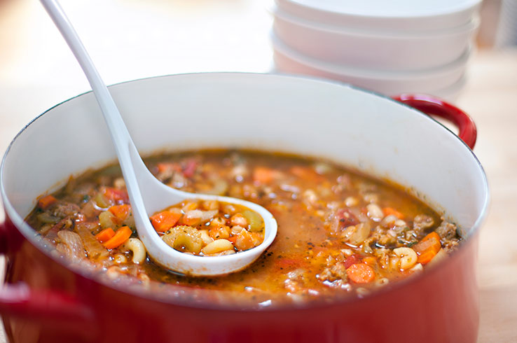 Soup made with Pulses being scooped out of a pot at a soup kitchen